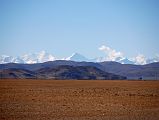 31 Annapurna III and Gangapurna From Just After Old Zhongba Tibet Just after leaving Old Zhongba on the way to Mount Kailash, the mountain panorama to the south includes Annapurna III, the broad white mountain to the left, and Gangapurna, the pointed peak in the middle mostly in shadow.